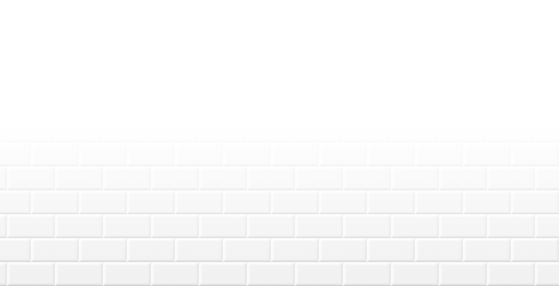 A white brick wall with a glossy finish, composed of evenly spaced tiles, creating a clean and minimalist appearance.