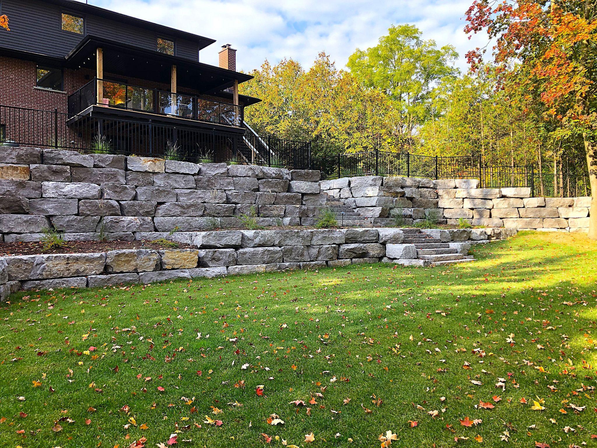 Large armour stone retaining wall terrace